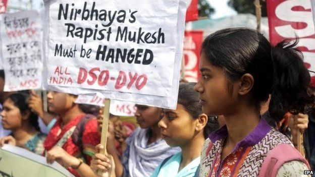 Socialist Unity Centre of India activists hold placards during a protest demanding death penalty for convicted gang-rapist, in Calcutta, 4 March