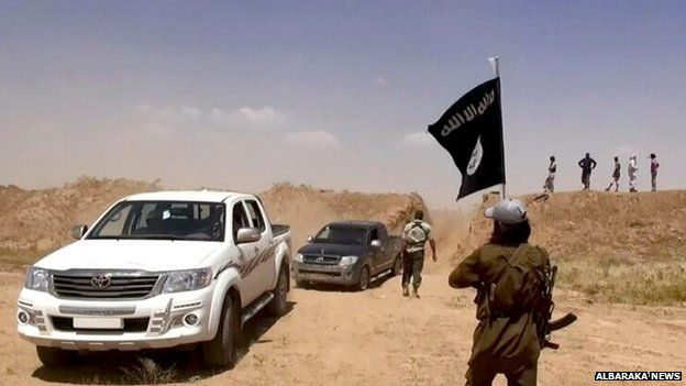 Islamic State militants on the Iraq-Syria border