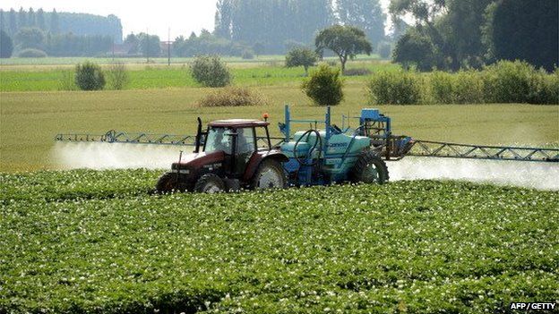 A farmer spreads pesticides on a field in Vimy near Lens, France on 24 June 24 2014