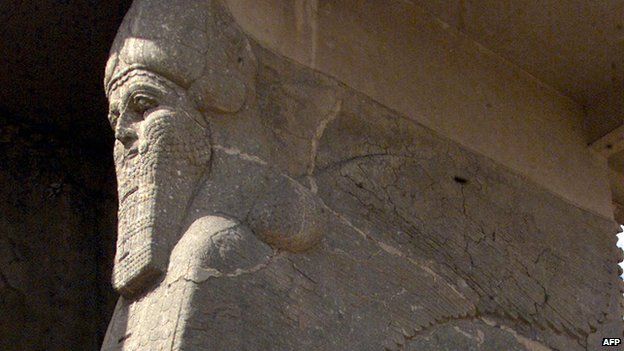 Ancient statue of a winged bull with a human face at the archaeological site of Nimrud, south of Mosul in northern Iraq, in 2001