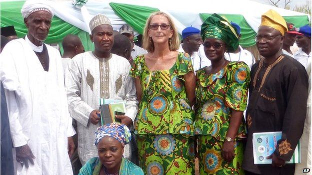 Seattle missionary Phyllis Sortor stands at centre with a delegation of area dignitaries in a town in Nigeria.