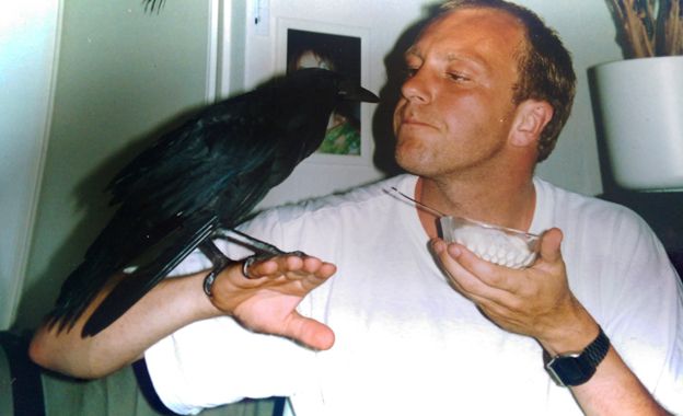 Rick Zevering with his crow perched on his hand