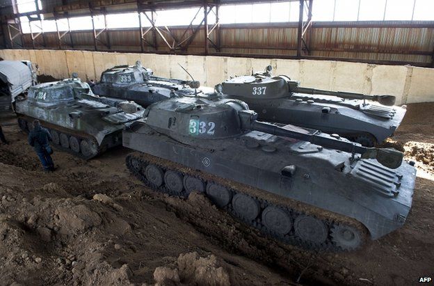 Self-propelled guns of the self-proclaimed People's Republic of Donetsk are parked in a hangar in Snizhne, some 90km (56 miles) east of Donetsk, 7 March