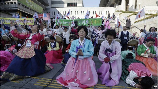 South Korean Christian women pray for the speedy recovery of U.S. Ambassador to South Korea Mark Lippert, during a gathering near the U.S. embassy in Seoul, South Korea, Saturday, 7 March 2015