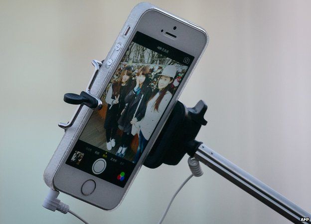 Selfie stick with smartphone