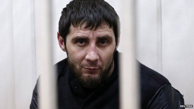 Zaur Dadayev, charged with involvement in the murder of Russian opposition figure Boris Nemtsov, looks out from a defendants' cage inside a court building in Moscow, 8 March 2015.