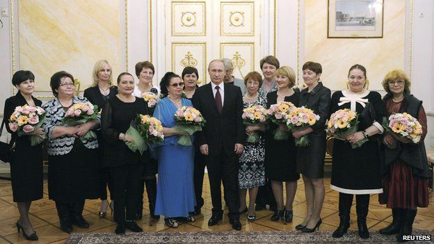 President Putin with a delegation of women