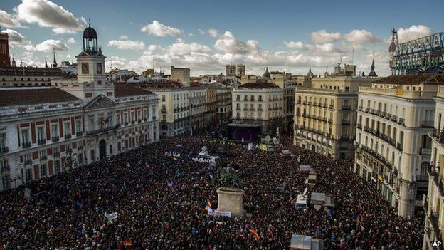 People arrive to the main square of Madrid during a Podemos (We Can) party march in Madrid, Spain, Saturday, 31 January, 2015