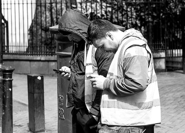People using their mobile phones