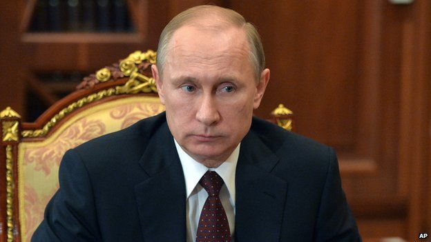 Russian President Vladimir Putin listens during a meeting at the Kremlin, in Moscow, Russia,