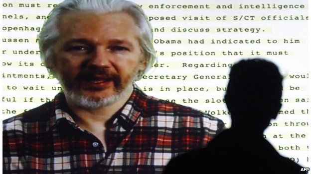 Julian Assange on a video link to a human rights conference in Barcelona