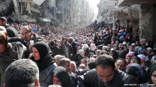 Residents of Syria's besieged Yarmuk Palestinian refugee camp, south of Damascus. File photo