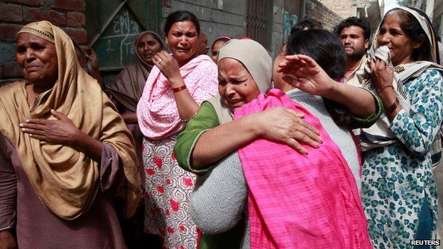 Pakistani women mourn the death of a relative in the church attack