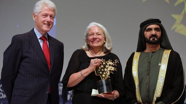 Nancie Atwell, centre, with former US President Bill Clinton, left, and Sheikh Mohammed bin Rashid Al Maktoum, prime minister of the U.A.E. and Ruler of Dubai