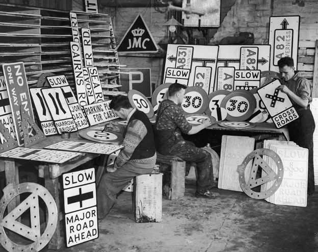 Signwriters prepare 30mph signs in 1935