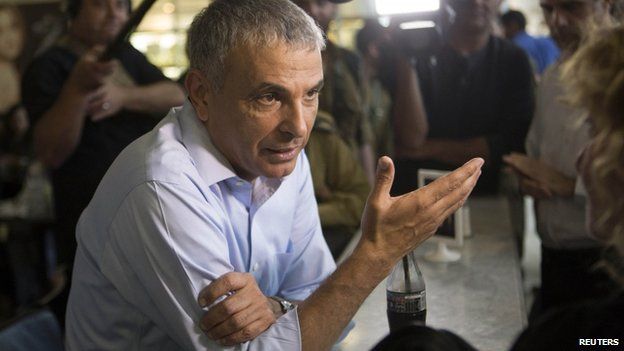 Moshe Kahlon, head of the new centrist party, Kulanu (All of Us), speaks to the media while campaigning at a shopping mall in Tel Aviv March 15, 2015