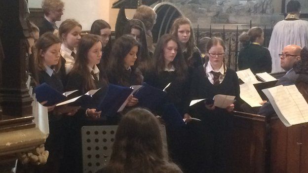 Queen Elizabeth High School choir perform at the service