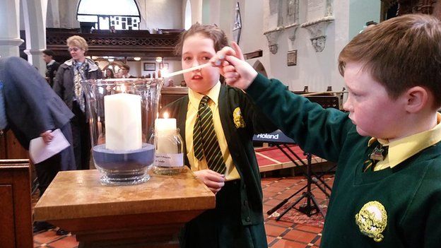 Candles lit at the service
