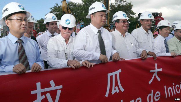 Chinese businessman Wang Jing (C) of HKND Group, members of the Nicaraguan government and members of the Commission of the Grand Inter-Oceanic Canal attend the inauguration of the works in Tola, some 3 km from Rivas, Nicaragua, on 22 December, 2014
