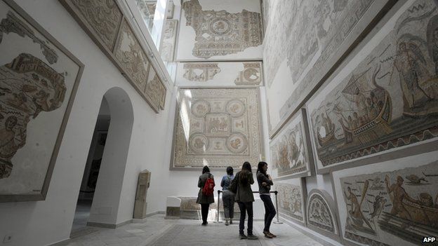 Tourists watch mosaics at Bardo museum in Tunis, 17 May 2012