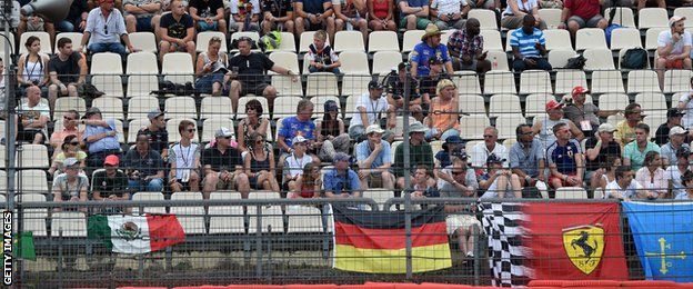 The crowd watches the German Grand Prix from the grand stand