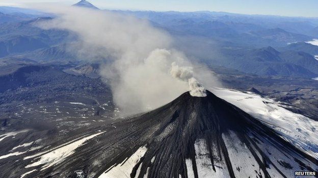 An aerial view shows smoke and ash rising from Villarrica Volcano on 18 March, 2015.
