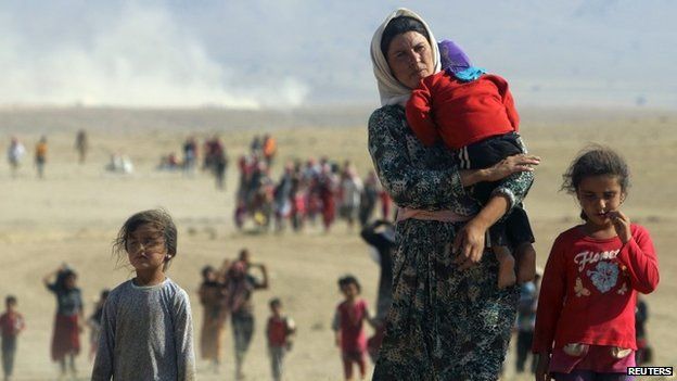 Displaced people from the minority Yazidi sect, fleeing violence from forces loyal to the Islamic State in Sinjar town - August 11, 2014