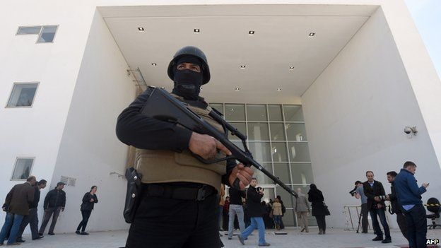 Tunisian security forces stand guard outside the National Bardo Museum in Tunis. 19 March 2015