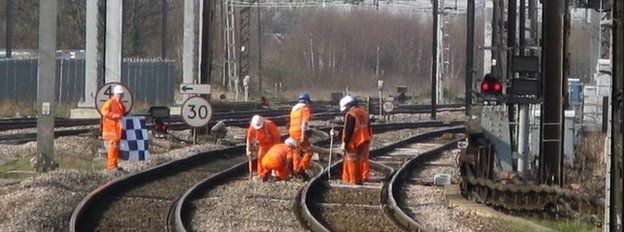 Workmen on a rail line