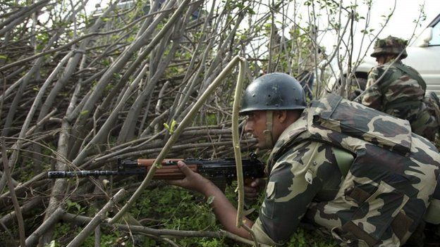 Indian paramilitary soldiers take position in Kathua district on March 20, 2015