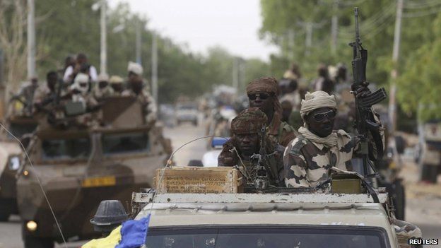 Chadian soldiers drive in the recently retaken town of Damasak, Nigeria, 18 March 2015