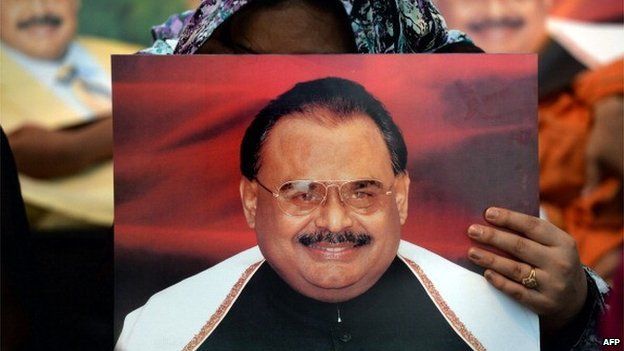 Supporters of Pakistan's Muttahida Qaumi Movement (MQM) party hold photographs of party leader Altaf Hussain as they stage a sit-in calling for his release in Karachi on June 3, 2014