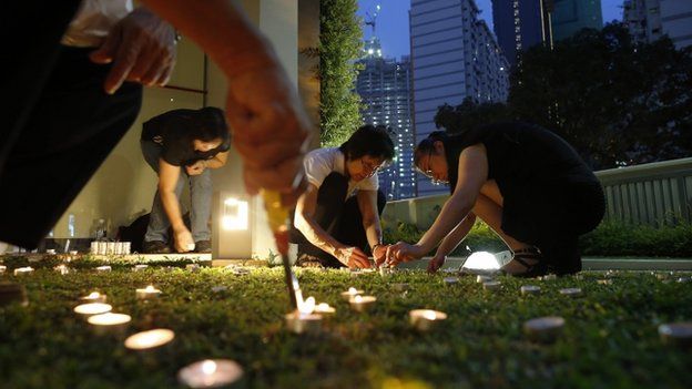 Candles lit to form RIP at community club in Singapore. 23 March 23