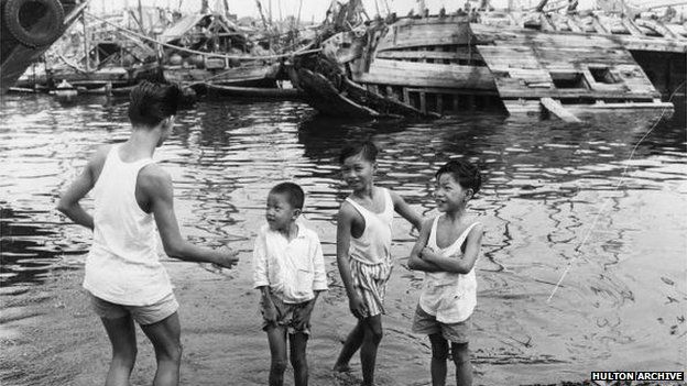 Children by the Singapore harbour in 1963