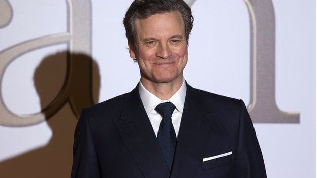 Colin Firth in a suit at the Kingsmen premiere