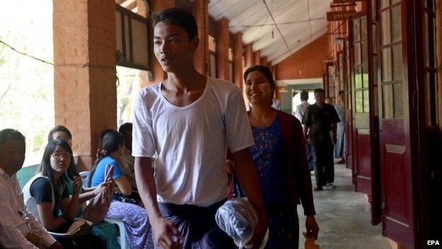 Student protester Soe Lwin Kyaw (L) walks out as he is released from TharYarwaddy district administrative office in Bago division, Myanmar, 12 March 2015.
