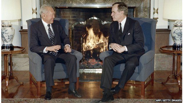Singapore Prime Minister Lee Kuan Yew (L) chats with US President George Bush in Tokyo on February 24, 1989 after they attended the funeral of Emperor HIrohito. (JEROME DELAY/AFP/Getty Images)