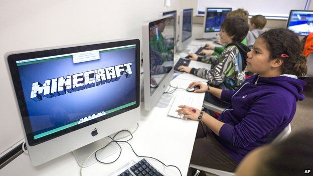 Student stares at computer with "Minecraft" flashed up on monitor