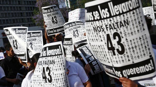 Protesters march to demand justice for the 43 missing students of the Ayotzinapa Teacher Training College, in Mexico City