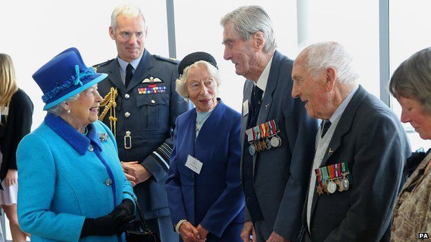 Queen meets Mrs K Foster (left), Wing Commander Paul Farnes (centre) and Squadron Leader Tom Pickering