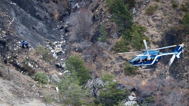 A French helicopter flies over the crash site. Photo: 25 March 2015