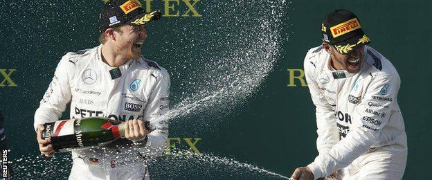 Mercedes drivers Nico Rosberg and Lewis Hamilton celebrate on the podium