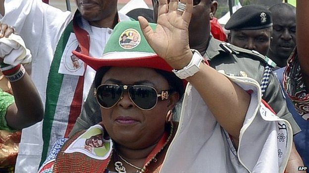 Wife of Nigerian President and candidate of the ruling People's Democratic Party (PDP) Patience Jonathan (C) waves as she campaigns for her husband, Goodluck, during a rally ahead of national election in Akure, Ondo State in southwestern Nigeria, on 24 March 2015