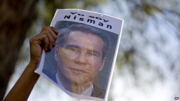 A demonstrator holds a sign that reads in Spanish "I am Nisman" during an act to demand justice following the death of special prosecutor Alberto Nisman, outside the court house in Buenos Aires, Argentina, Wednesday, March 18, 2015