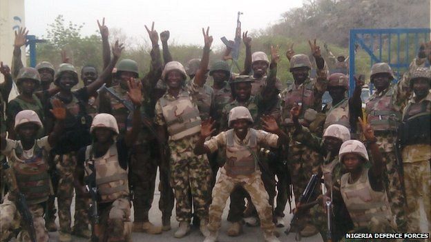 Nigerian soldiers celebrating their capture of Gwoza in Nigeria
