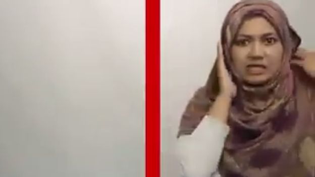 In the video, Aisyah "crosses the border" into Kelantan and finds herself involuntarily donning a headscarf