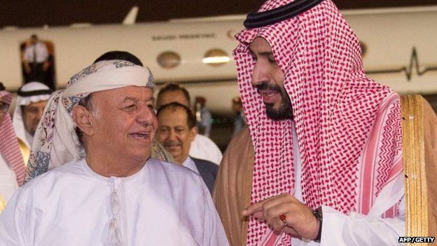 A handout picture provided by the Saudi Press Agency (SPA) on 26 March 2015 shows Saudi Defence Minister Prince Mohammed bin Salman (R) receiving Yemeni President Abdrabbuh Mansour Hadi upon his arrival at an airbase in the Saudi capital Riyadh