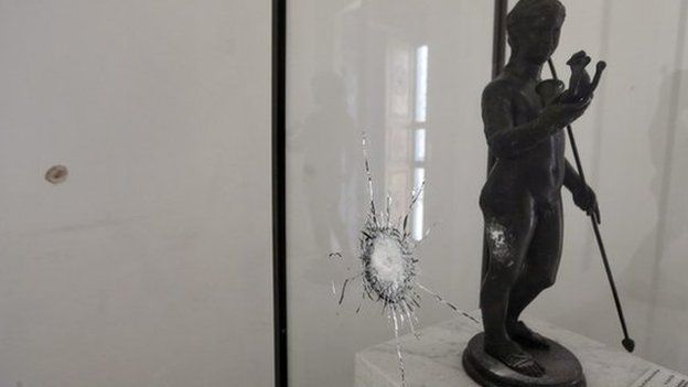 A general view shows a staute and its display case damaged when gunmen opened fire on visitors to the National Bardo Museum, Tunis, Tunisia