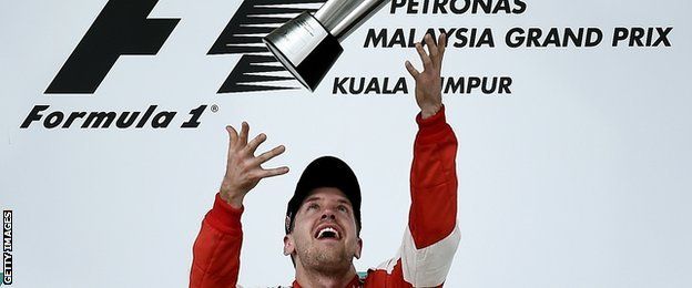 Sebastian Vettels throws trophy