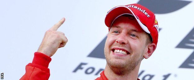 Sebastian Vettel holds up one finger to show he is number one again